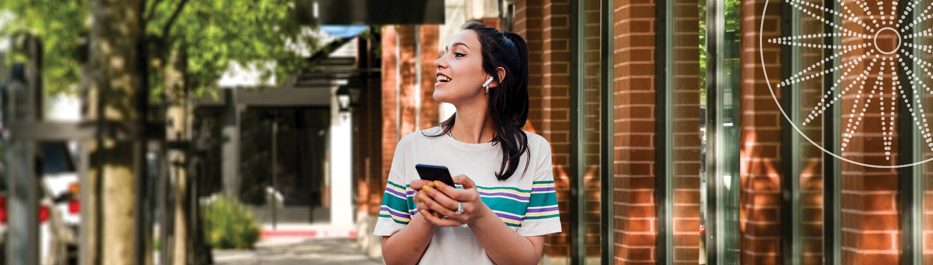 young woman walking while listening to music